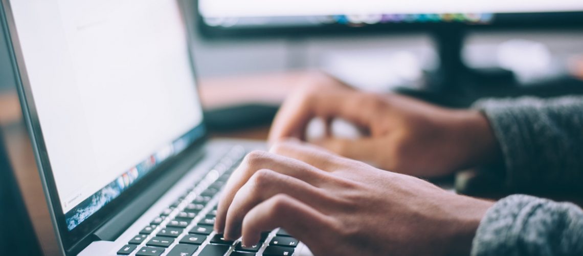 Close Up of Professional Typing on a Computer