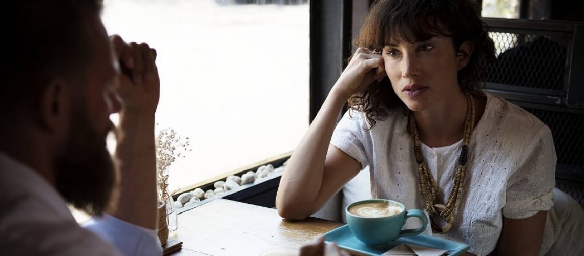 Two People at Breakfast Resolving Conflict