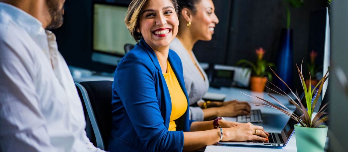 Woman Engaging with Coworkers